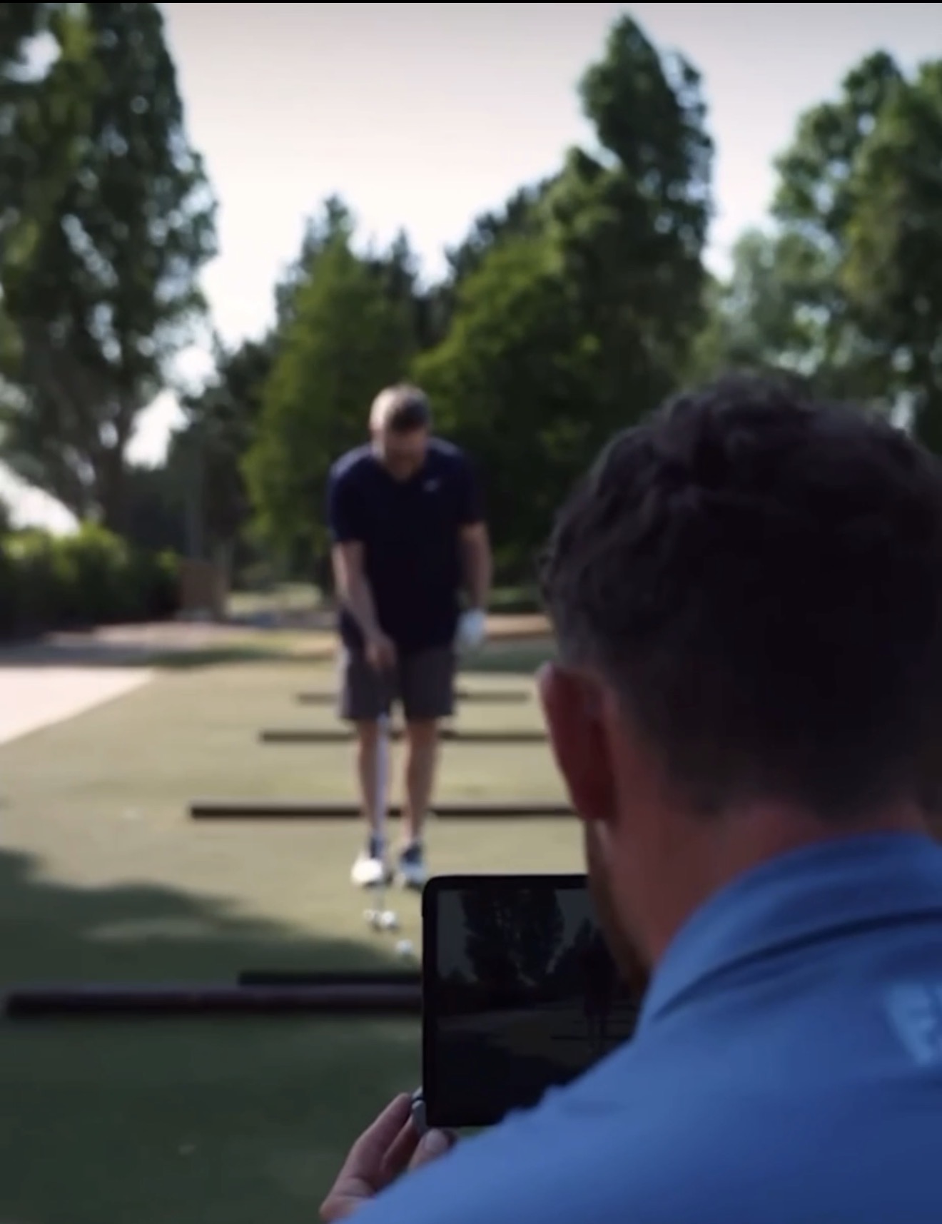 Filming a swing on the range